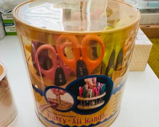 A pail full of crafting scissors