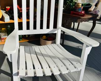 Four white porch rockers