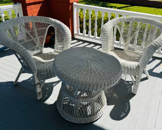 Two wicker chairs with side table