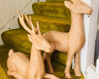 Two of many papier-mâché deer