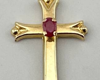 14kt gold cross pendant with center set ruby