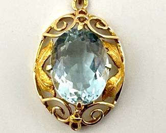14kt fancy pendant in Arts and Crafts setting with blue topaz colored stone