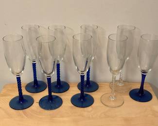 M231. Set of 6 twisted cobalt blue champagne flutes, 1 misc and 2 clear $20