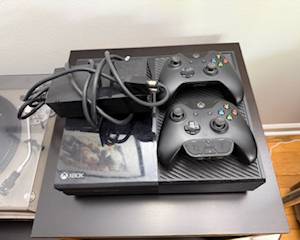 X-Box One with three controllers