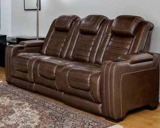Leather couch with motorized, heated, massaging and reclining seats, great for watching TV or a home theater! Storage in side arm rests.  Middle seat can fold down and become a double cup holder for the side seats.  Bought in 2022 for over $2000.  