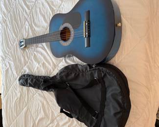 Small blue guitar and case
