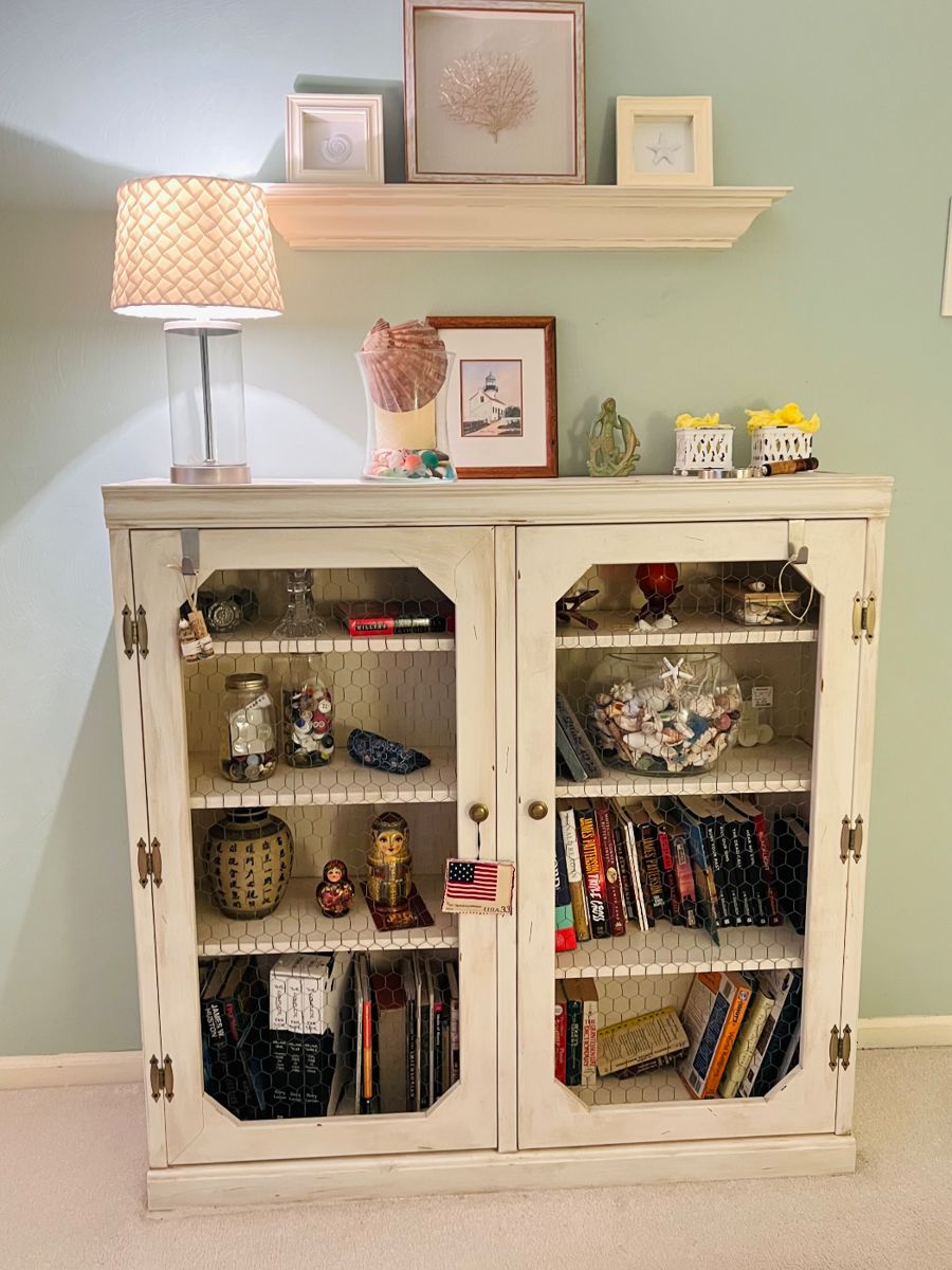 Beautiful bookcase with costal decor