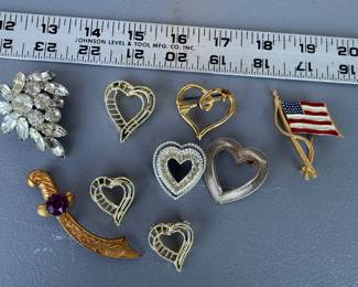 9 Brooches $18.00