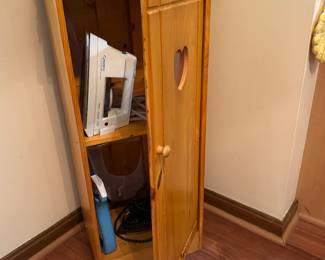 Compact ironing board cabinet