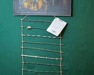 785  Barbed wire wall hanger and print of vintage bits 