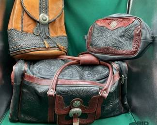 398  Three western style leather travel bags 