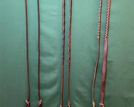 751 Three pair of roping reins, one martingale, one tiedown and one headstall