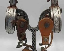78  Vaquero style heavy iron spurs with mismatched spur straps 