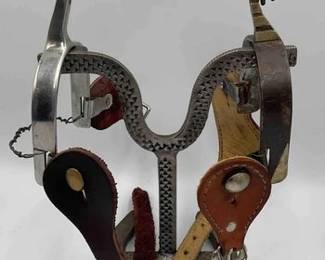 85  Mismatched spurs with spur straps 