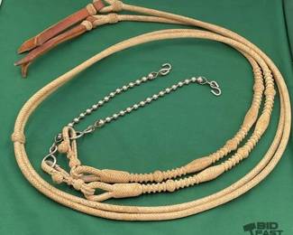 704 Braided rawhide split reins with slobber chains