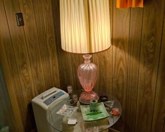mid-century modern pink glass lamp, glass top table, vintage ash tray and table lighters