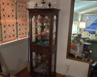 Light up curio cabinet with drawer in the middle 