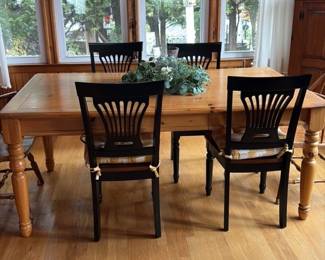 Black Spindle Back Dining Chairs with Wooden Table 