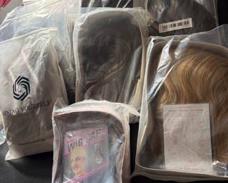 Several packages of wigs and wiglets  new in the box