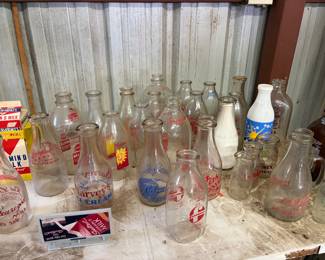 Large selection of Vintage Milk Bottles with branding