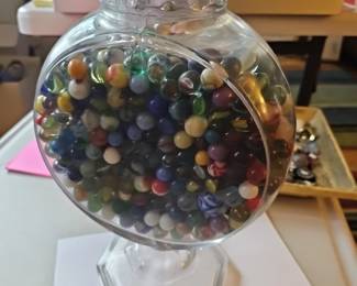 Large vessel full of old marbles.