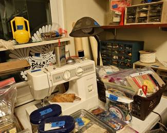 Current sewing machine and lots of sewing items...remnants, buttons , thread and more!