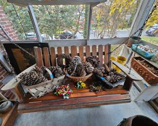Outdoor swing loaded with pine cones.