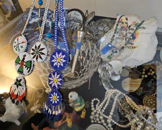 Toby mugs and Native American jewelry. Other costume jewelry and sterling jewelry.