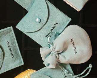 Tiffany jewelry and two purce size hand mirrors.
