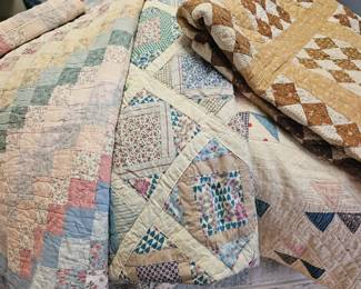 Several vintage quilts!