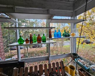 Colored glass bottles out door swing.