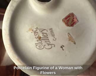 Porcelain Figurine of a Woman with Flowers