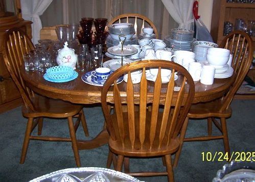 Oak pedestal table, one leaf, four chairs, china and glassware