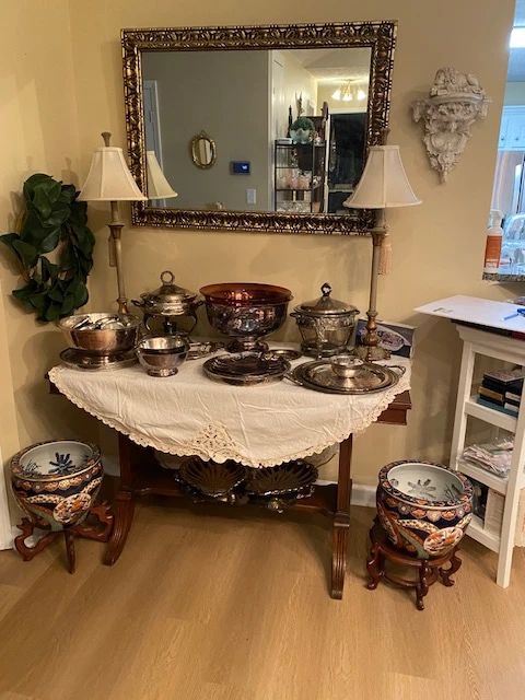 Dinning Room: Silver plated platters and Cherry wood table, large mirror