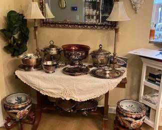 Dinning Room: Silver plated platters and Cherry wood table, large mirror