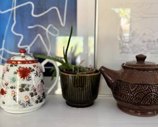 tea kettle, brass candlestick, plant, tea kettle