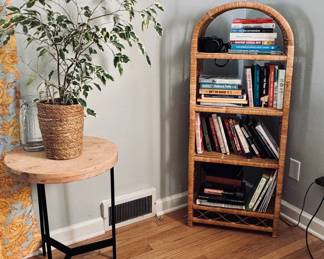 table, plant, wicker shelf, books