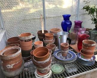2 for $1 - Clay pots.  Flower vases, saucers, plants, etc.
