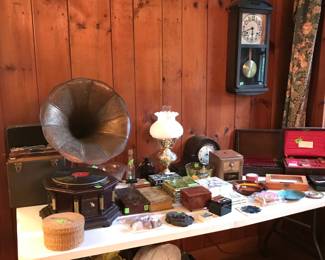 Victrola, records, lamp, mantle  clock, grass basket, rocks, music boxes, coin bank,  wood boxes and more.