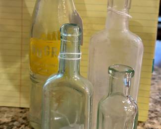 Multiple antique glass bottles