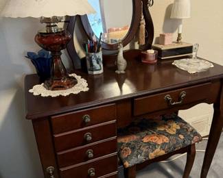 Makeup and jewelry dresser with stool.