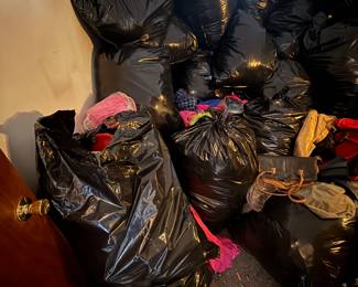 These are all contractor bags full of new clothes, shoes and handbags, all with tags that we had to bag up to get out of the way, maybe 10,000 pieces