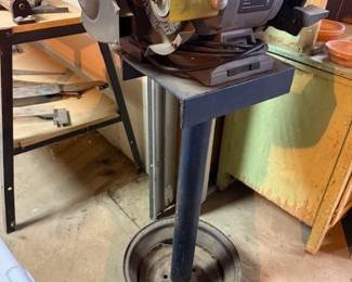 Two grinders on metal stand. 