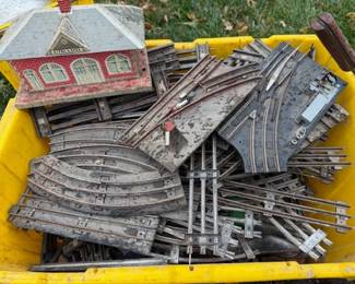 Just found railroad train set. Tin station. Couple of cars. 