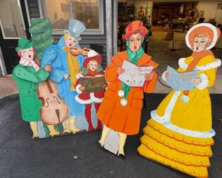 Vintage folk art Christmas carolers. Musicians have articulating arms.