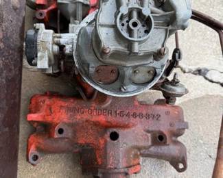 Manifold with Holly carburetor. 