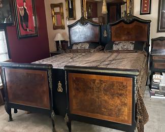 Gorgeous beds and many wall mirrors