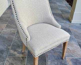 $200 (each) - upholstered nail head dining chair (10 available) - 20x24x35. Perfect condition!