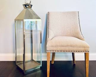 $100 - Large stainless steel lantern, 12L x 12W x 47H. We have two of these, however the matching one (not pictured) is missing the glass door and is $80.