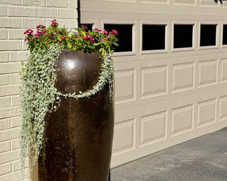 $400 - Statement planter; tall glazed pot, bronze color with plants - 20x46 (We found these online for $700 and up. Snag this deal!)